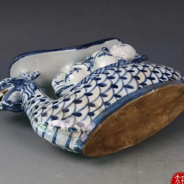 Afralia™ Blue White Porcelain Child Sleep Dragon Boat Statue