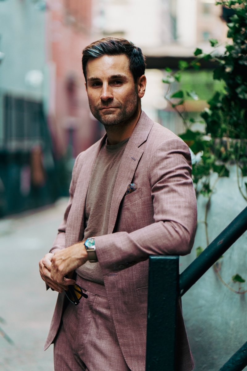 Shane in a dusty rose blend suit and taupe crewneck tee, styled with a pocket square and watch - custom suits nyc bespoke tailor midtown, noho